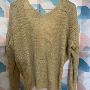 Tan waffle knit sweater with knot in back size L